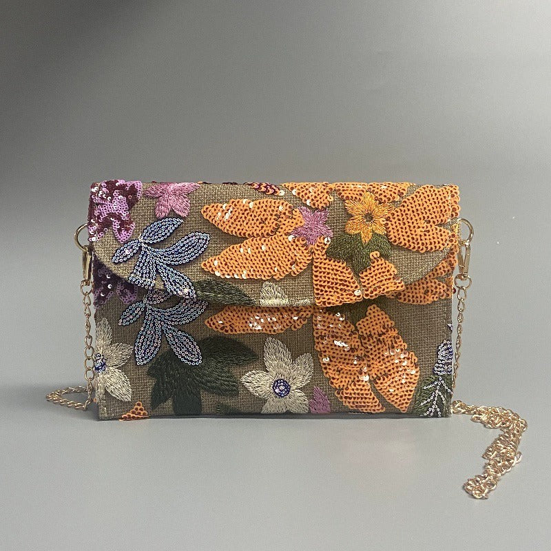 AUTUMNBLOOM | FLORALE CLUTCH-UMHÄNGETASCHE MIT PAILLETTEN