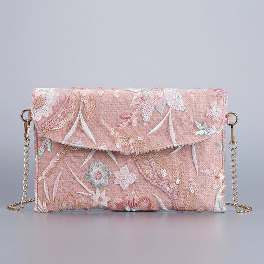 BLUSHGARDEN | ROSAFARBENE PAILETTEN-CLUTCH-UMHÄNGETASCHE MIT BLUMENMUSTER