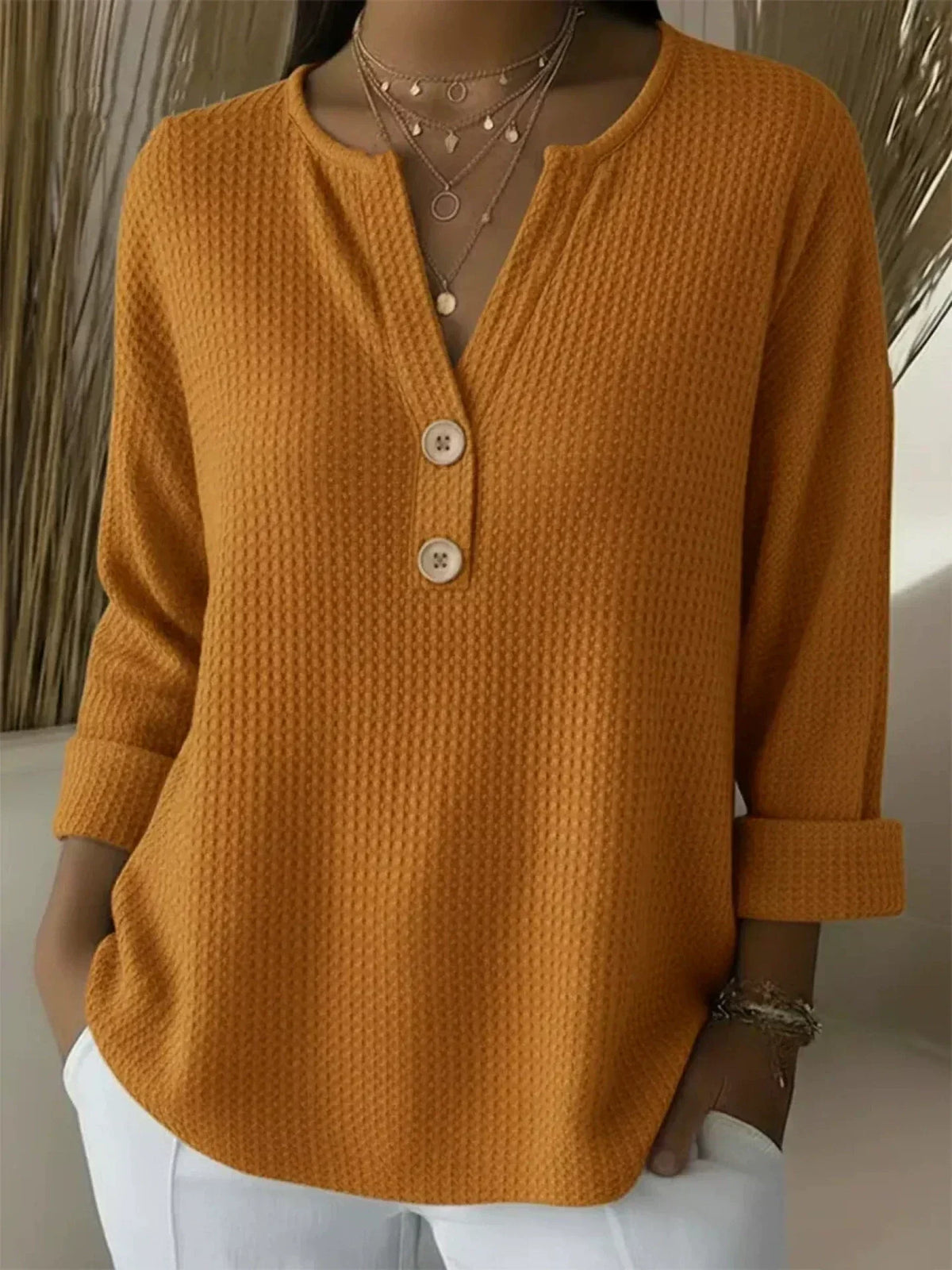 LUCINDA | HENLEY-OBERTEIL MIT KNOPFLEISTE